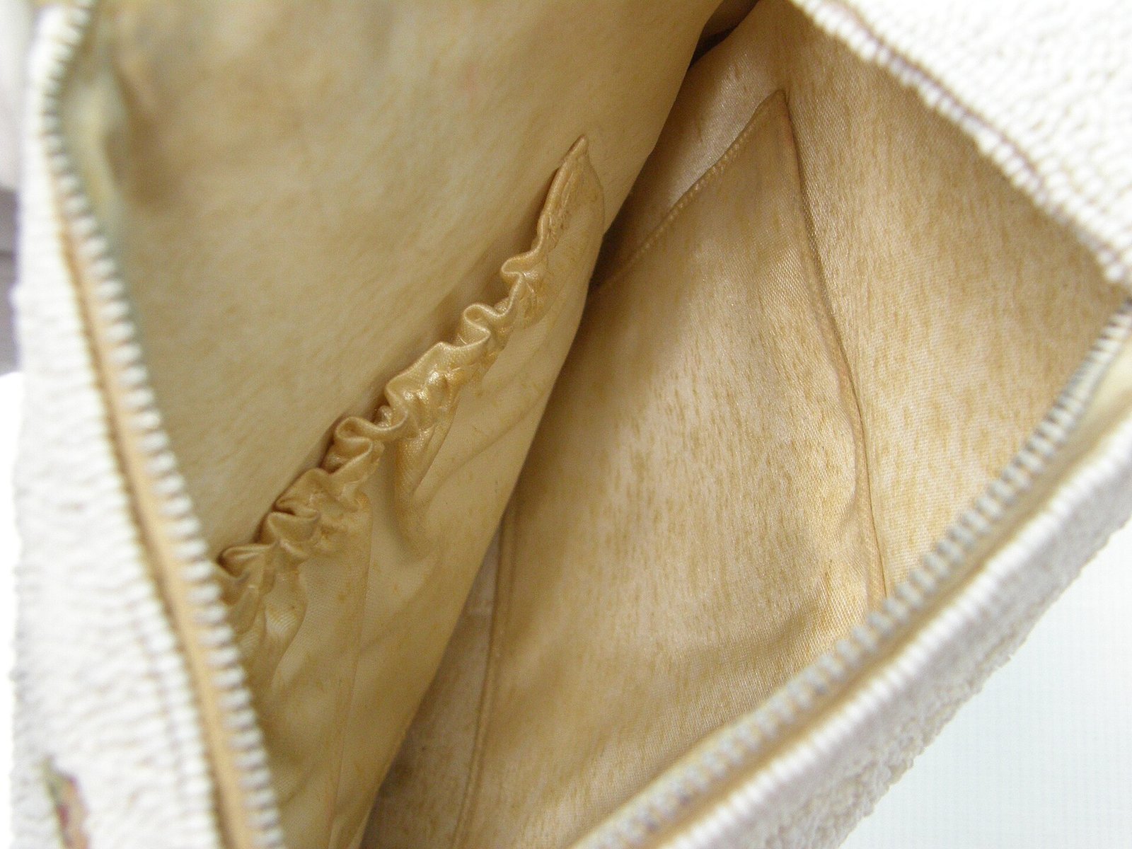 A white beaded circular handbag from a museum collection