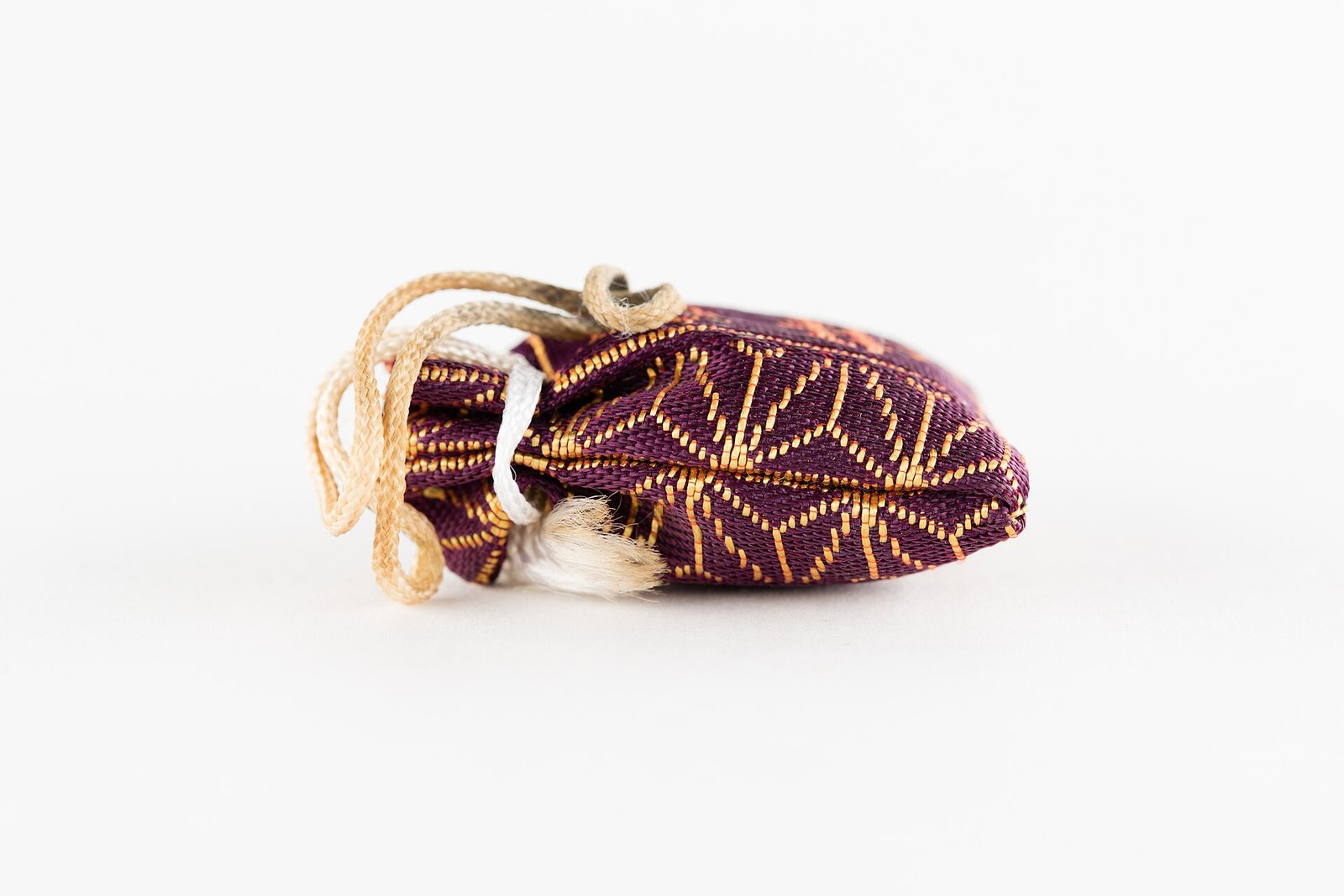 Purple silk drawstring pouch with gold characters